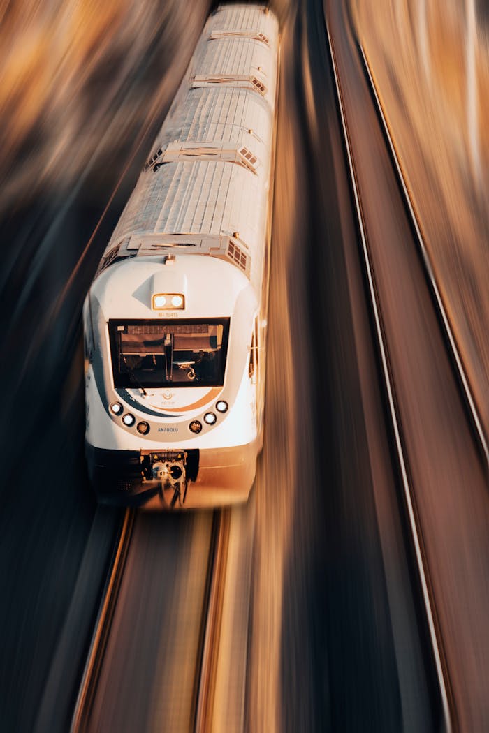 services-01 A high-speed train captured from above, showcasing dynamic motion in Karaman, Türkiye.